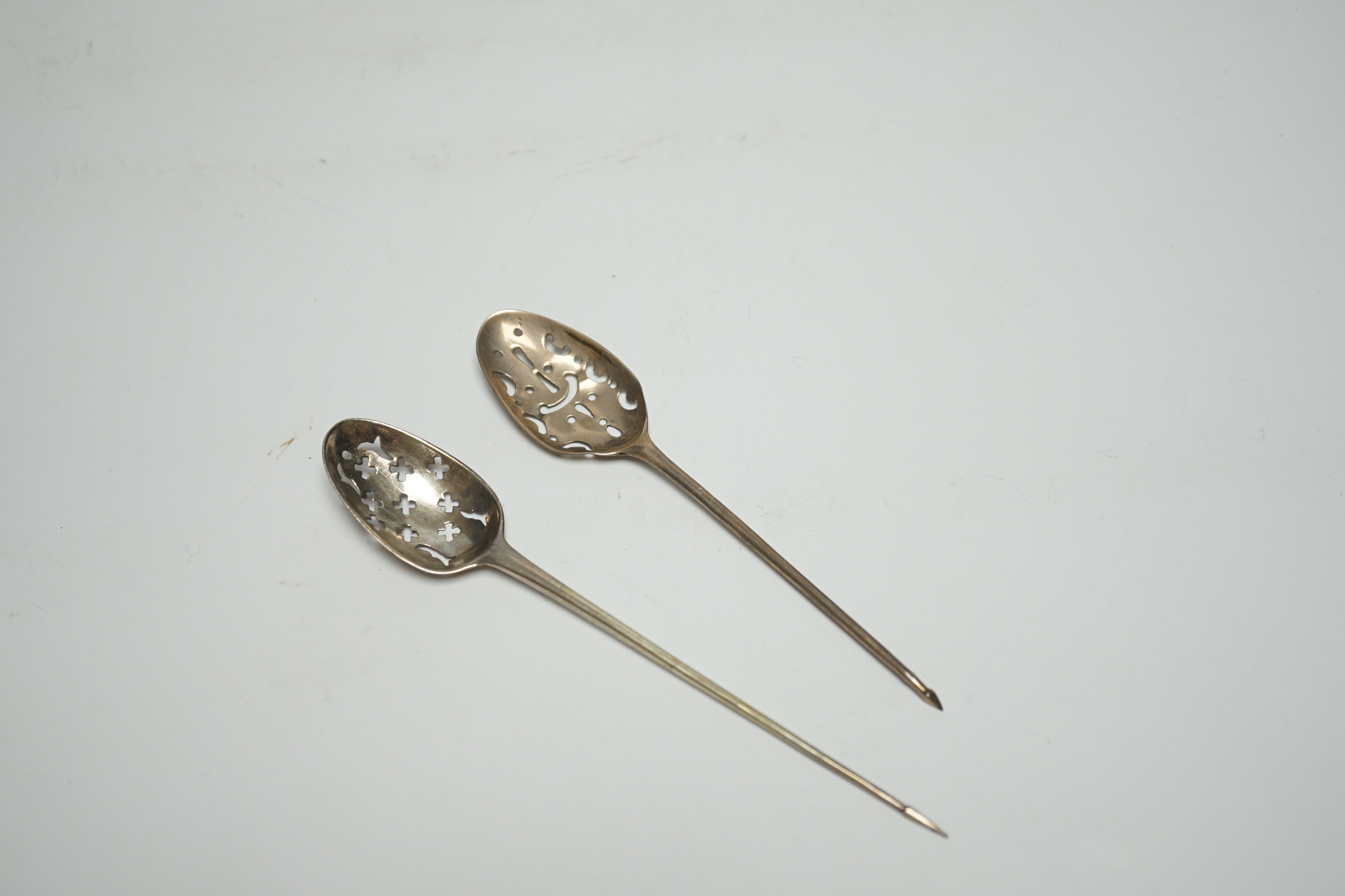 Two Georgian silver mote spoons, 14.1cm.